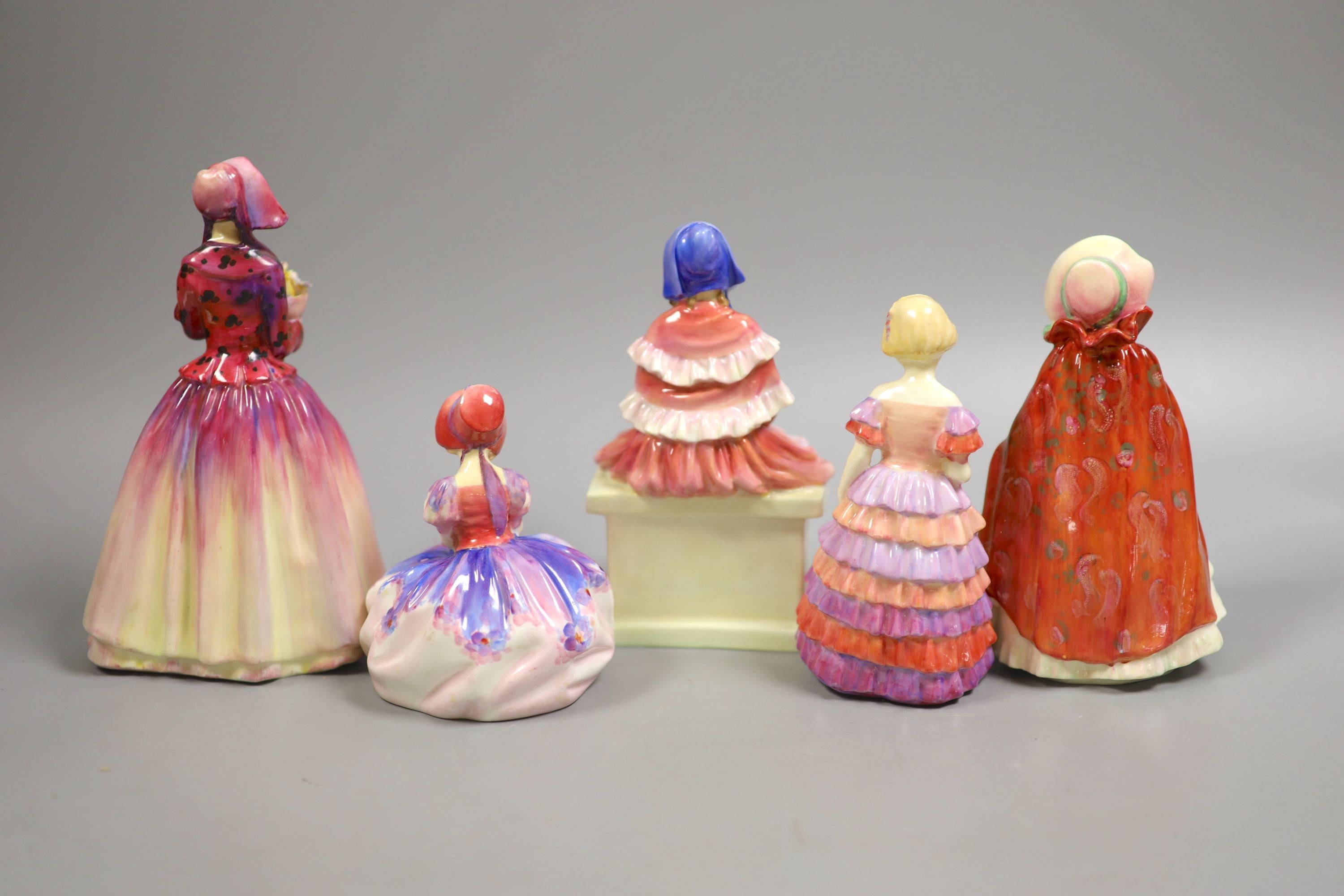 Five Royal Doulton figurines: Dorcas RN769308, Forget-me-not RN816194, Granny's shawl HN1647 RN704188, Monica HN1467 RN762875, Little Bridesmaid HN1453 Rn760007